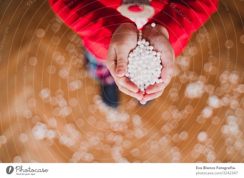 Kid holding artificial snow flakes at home Joy Beautiful Playing Winter Snow House (Residential Structure) Child Masculine Toddler Girl Boy (child) Hand 1