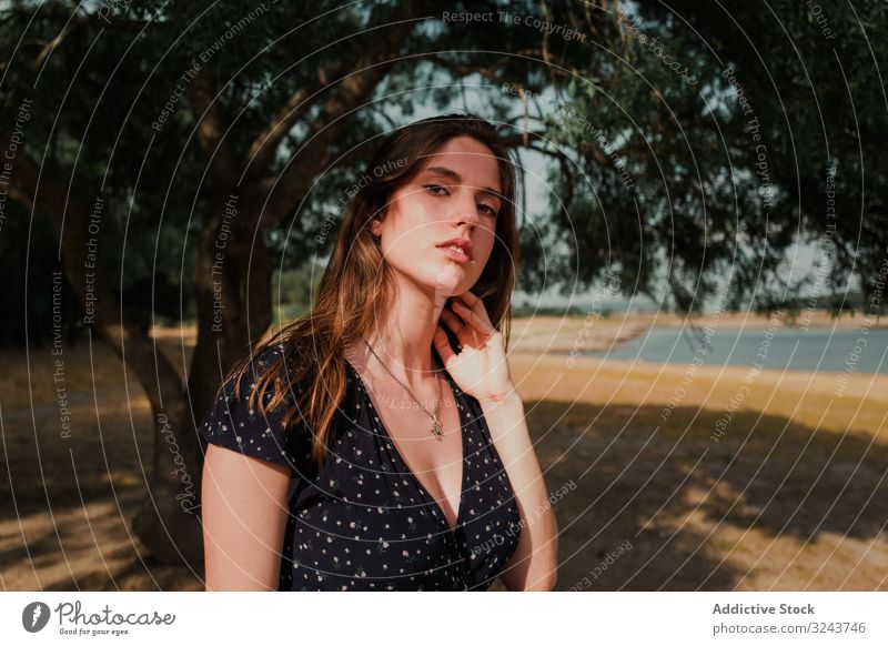 Woman with long hair standing near seaside woman stylish vacation marina water summer holiday beach enjoy creative inspiration adventure freedom serene journey