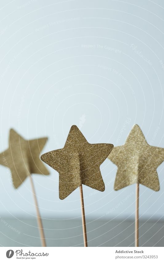 Cutout golden stars on stick for decoration christmas celebration holiday season present papercraft festive glitter gift small symbol shiny toy decorative