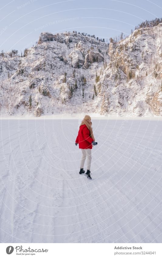 Frozen woman wrapped in scarf on winter day cold frozen siberia snowy mountain nature rock hill russia female environment wild adventure activity protection