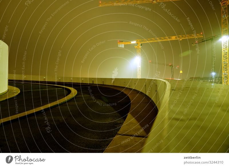 Underground car park in fog Transport Expressway exit Spiral Multi-story garage Underground garage Curve Haze Fog Floodlight Asphalt Evening Train station