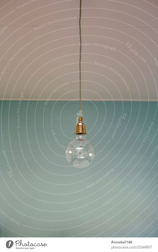 hanging light bulb blue pastel background. Style Design Decoration Lamp Business Technology Art Fashion Old Simple Bright Modern Retro Blue Black White Energy