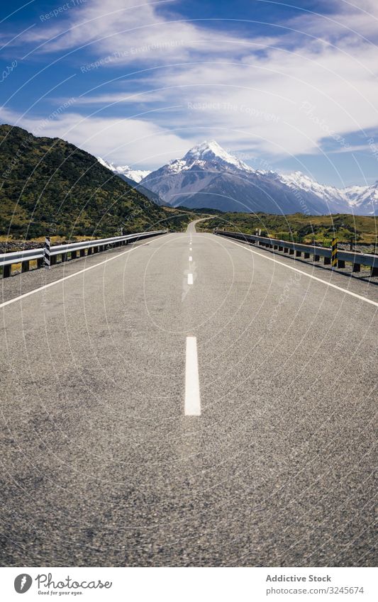 Route among big mountains at New Zealand road cliff nature landscape travel rock blue sky summer route way stone view highway mountain cook new zealand trip