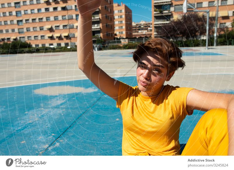 Trendy young woman on playground in sunny day frown teen cool millennial colorful urban female summer style teenager vibrant vivid contemporary modern