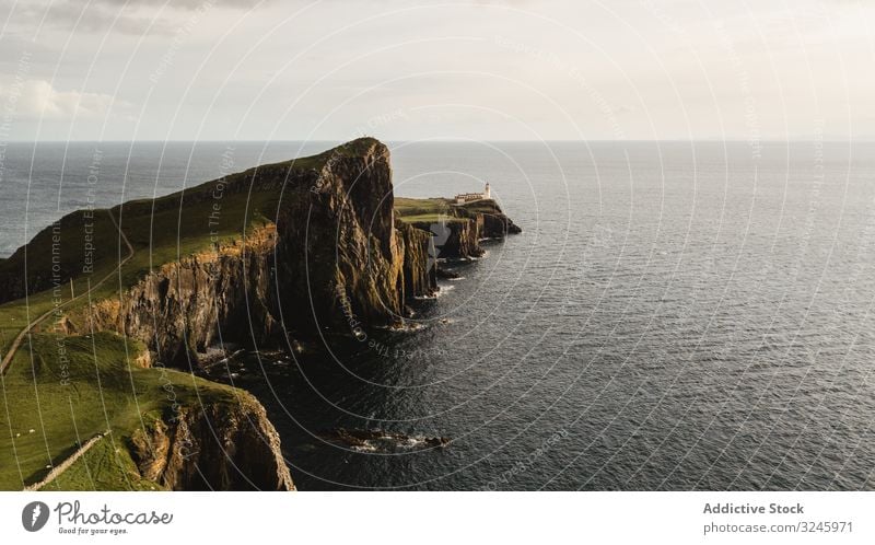 Rocky coast among tranquil ocean water in sunny day sea adventure height headland trip coastline cliff fresh freedom road solitude marine endless shore scotland