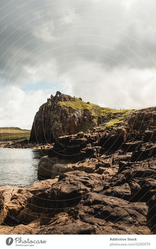 Rocky coast among tranquil ocean water in sunny day sea adventure height headland trip coastline cliff fresh freedom road solitude marine endless shore scotland