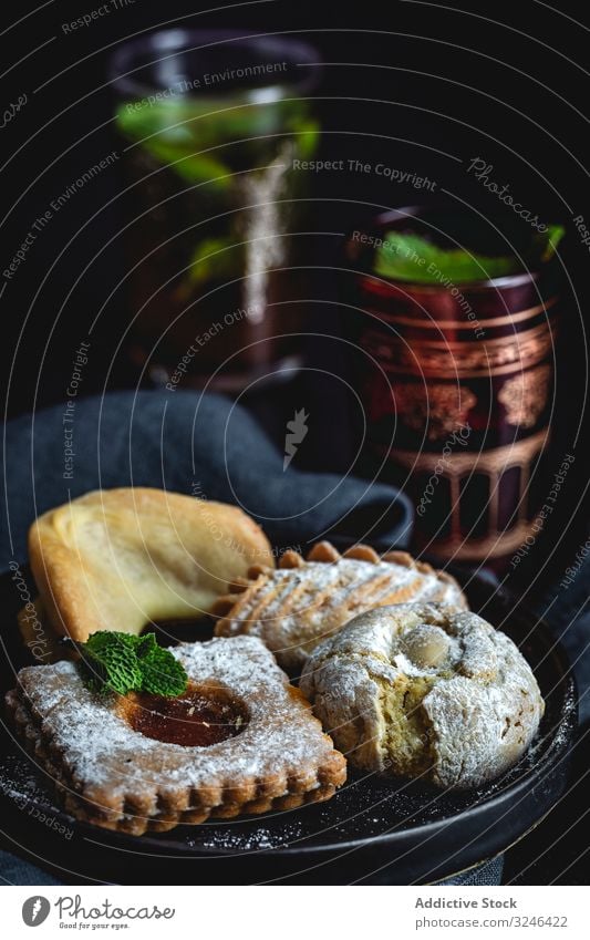 Traditional tea with mint and assorted Arab sweets arabic drink food dessert ramadan halal eid cookies homemade tasty culture muslim chebakia honey delicious