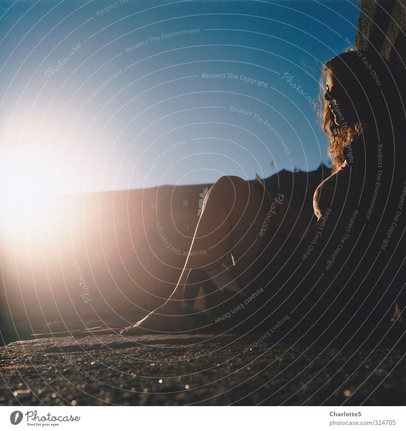 backlight Feminine Face Chest Feet Wall (barrier) Wall (building) Curl Spain Brick Cobblestones Stone Crouch Listening Wait Blue Acceptance Peaceful Analog