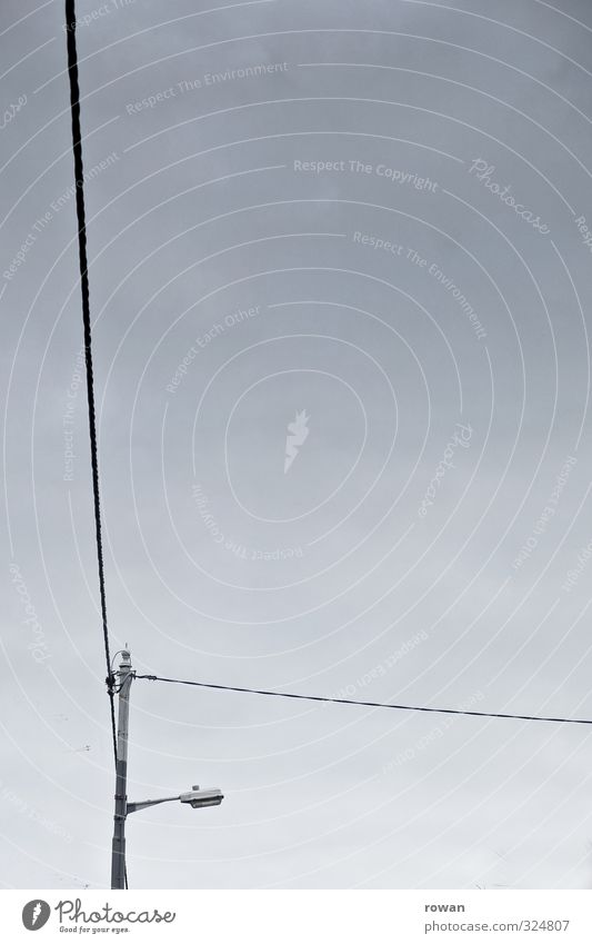 L Clouds Storm Dark Cable Electricity Lamp Lighting Connection Transmission lines Line Colour photo Subdued colour Deserted Copy Space right Copy Space middle