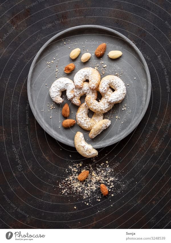 Vanilla croissant with almonds on a grey plate Food Dough Baked goods Cookie Austria Plate Christmas & Advent Rustic Table To enjoy Old Fragrance Sweet Infancy