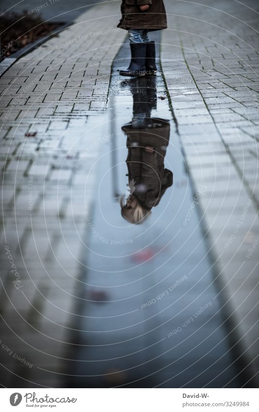 Child reflected in a puddle Mirror image reflection Infancy Future thoughts out Autumn Girl Playing Puddle Autumnal Rain Wet Bad weather Childhood memory