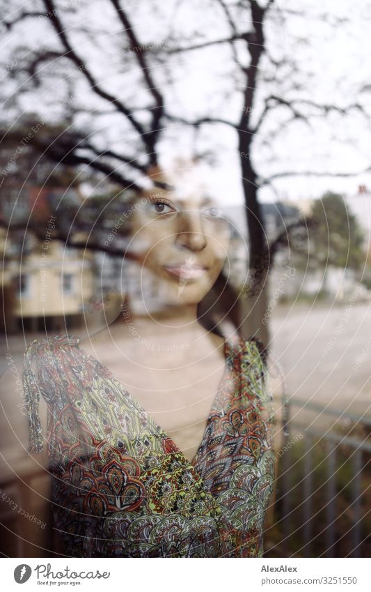 Portrait of a woman behind a window pane Style Beautiful Harmonious Flat (apartment) Town Window Young woman Youth (Young adults) 18 - 30 years Adults