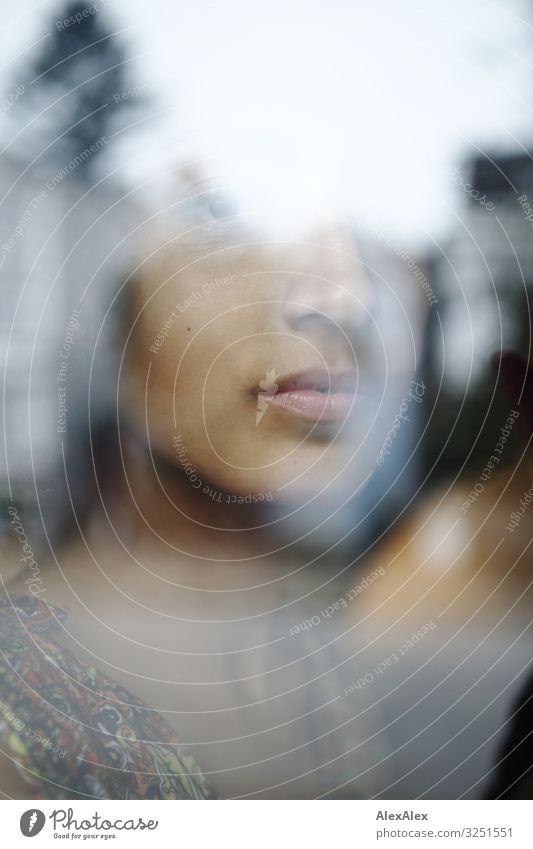 Portrait of a young woman behind a window pane Style Beautiful Well-being Living or residing Flat (apartment) Young woman Youth (Young adults) Lips