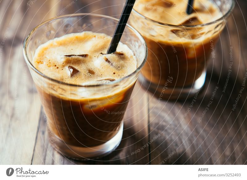 Glasses of iced coffee latte Dessert Beverage Coffee Summer Table Restaurant Wood Dark Fresh Delicious Brown Iced coffee milk Milkshake cold glass ice cubes