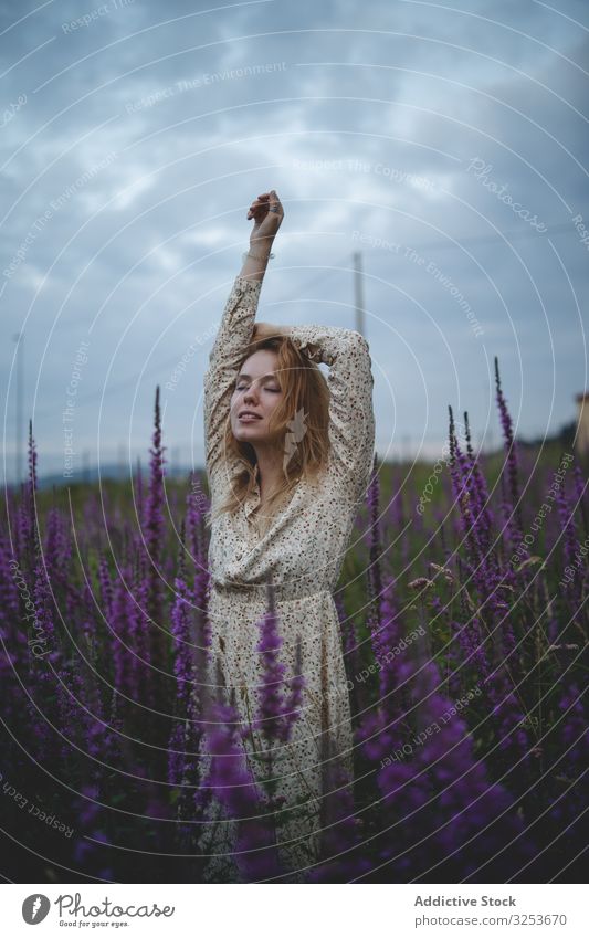 Romantic women in salvia field woman meadow enjoy sage flower blossom sensual romantic charming peaceful tender happy graceful harmony carefree rural village