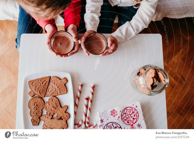 beautiful brother and sister at home having a delicious snack. Christmas concept Snack Cookie Candy Brother Sister siblings Christmas & Advent Home Blonde