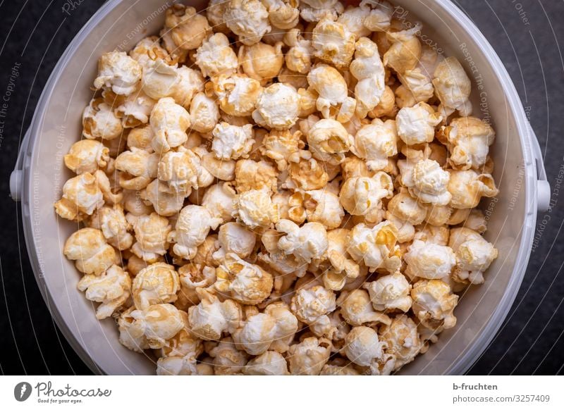 Popcorn in bucket Food Candy Nutrition Fast food Finger food Healthy Eating Select Observe To enjoy Fresh Nibbles Bucket Colour photo Interior shot Studio shot