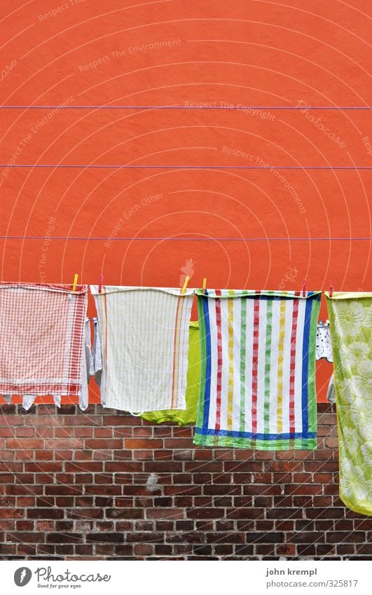 The little bit of household Wall (barrier) Wall (building) Towel Dish towel Clothesline Brick Stone Hang Fragrance Clean Orange Joie de vivre (Vitality)