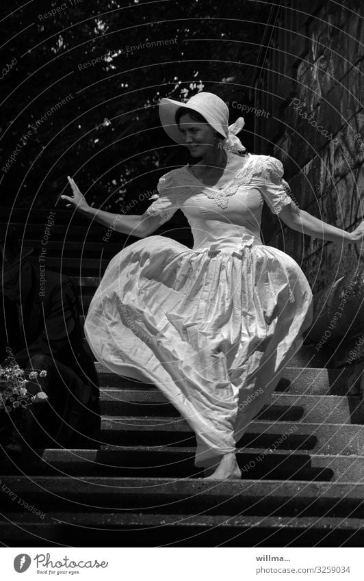 Woman in a nostalgic wedding dress and hat walks barefoot down a staircase - Queen of hearts Feminine Bride Wedding dress pretty Barefoot Elegant Graceful