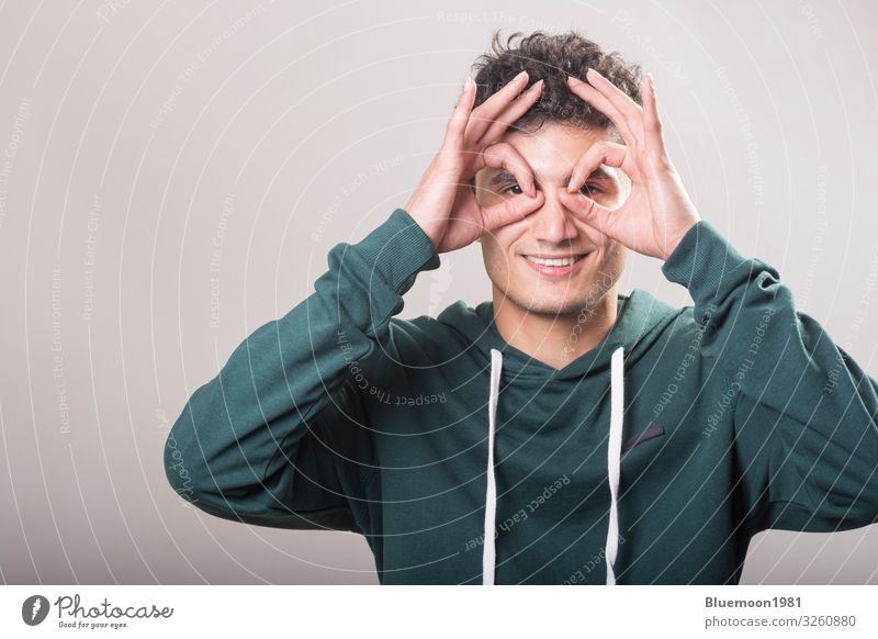 Young man wearing green pullover and holding his hands Lifestyle Joy Happy Wellness Profession Human being Youth (Young adults) Man Adults Hand Fingers 1