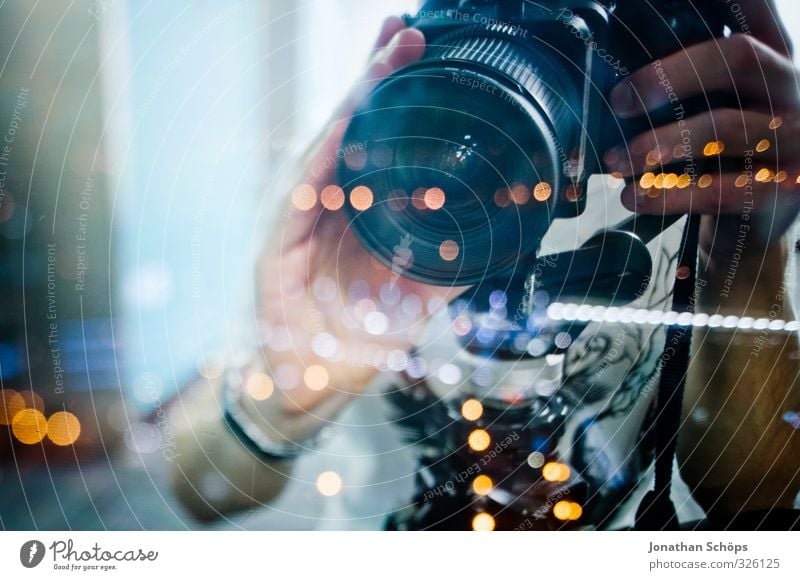 young photographer with tilt shift lens behind glass pane at night Human being Masculine Hand 1 18 - 30 years Youth (Young adults) Adults Esthetic Camera