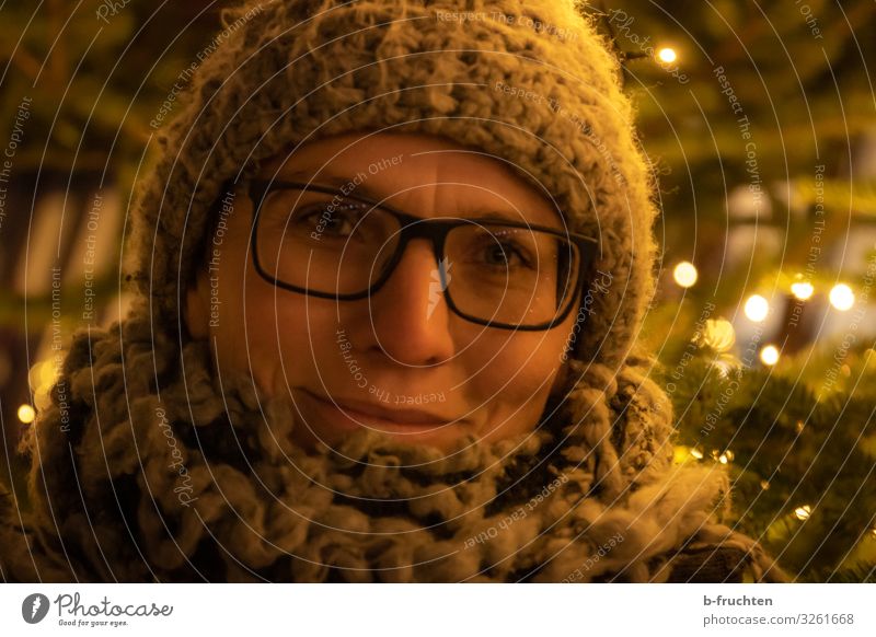 Woman with winter hat and scarf at a Christmas market Lifestyle Shopping Style Joy Leisure and hobbies Night life Event Feasts & Celebrations Christmas & Advent