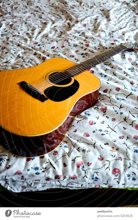 Guitar on the bed Musical instrument Song Lie Bed Bedclothes Pattern Flower Romance Deserted Copy Space