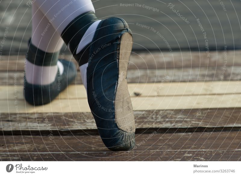 ballerina' s legs with blue shoes. Legs 1 Human being Dance Dancer Footwear Touch Cute Blue Threat Ballerina Wood Performance Woman Shadow Graceful Colour photo