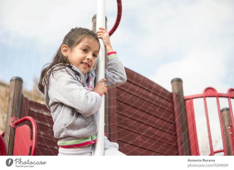 cool girl playing in playground bar Lifestyle Joy Happy Playing Climbing Mountaineering Child Human being Infancy Sky Castle Smiling Safety Loneliness Innocent