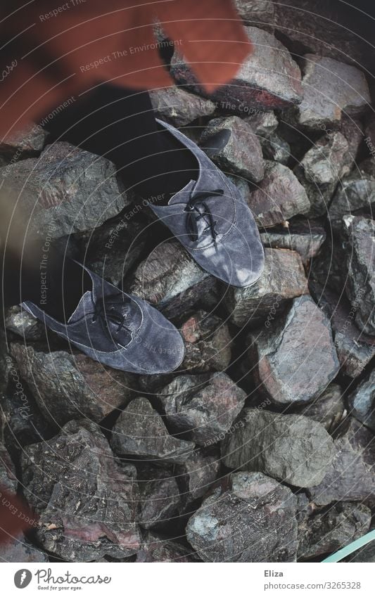 stand on stones Feminine Footwear Gray Stone Stand Barrier Uneven Colour photo Subdued colour Exterior shot Day Bird's-eye view