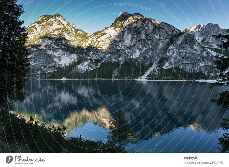 blue Vacation & Travel Nature Landscape Cloudless sky Sunrise Sunset Beautiful weather Rock Alps Mountain Dolomites Lake Pragser Wildsee Lake Italy South Tyrol