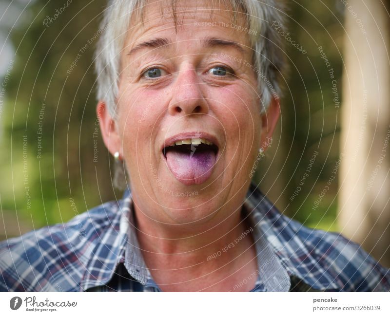 yuck | woman sticks out purple-blue tongue Human being Woman Portrait photograph Face Blue Laughter Joy blueberries Forest Eating Mouth Tongue Violet Selfie