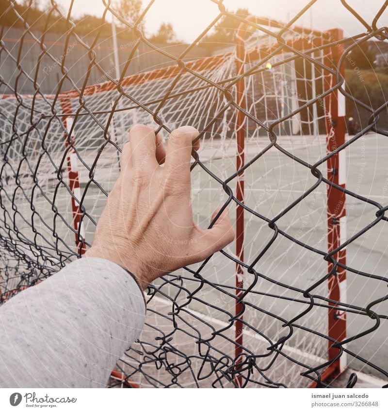 man hand grabbing a metallic fence Hand Fence Wire Safety (feeling of) Metal Protection Man Human being Fingers body part Arm Steel Street Exterior shot Freedom