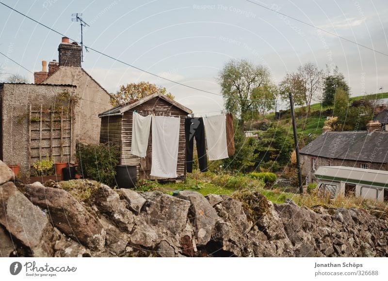 British village I Village House (Residential Structure) Detached house Hut Poverty Uniqueness Great Britain Living or residing Clothesline Idyll Rock Town Towel