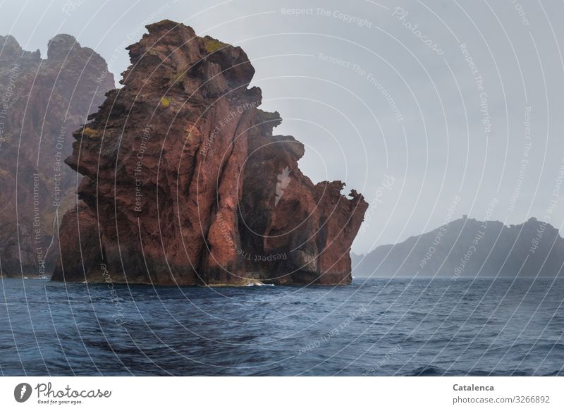 The jagged jags of the rock formation in the sea look like gargoyles Environment Landscape Water Sky Clouds Summer Bad weather Rain Rock Waves coast Ocean Cliff