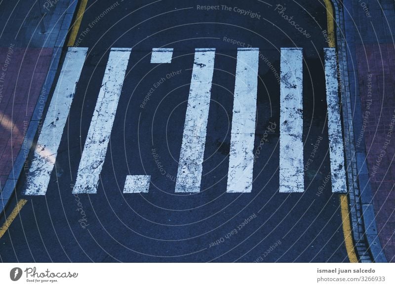 crosswalk on the road on the street in Bilbao city spain Line White Traffic sign signal Street Asphalt Signage Transport City Road sign Symbols and metaphors