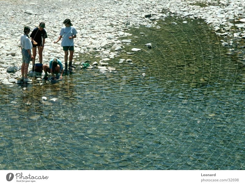 bank Girl Cleaning Human being Beach Group nearby River Coast Water Stone reflecting boy lake