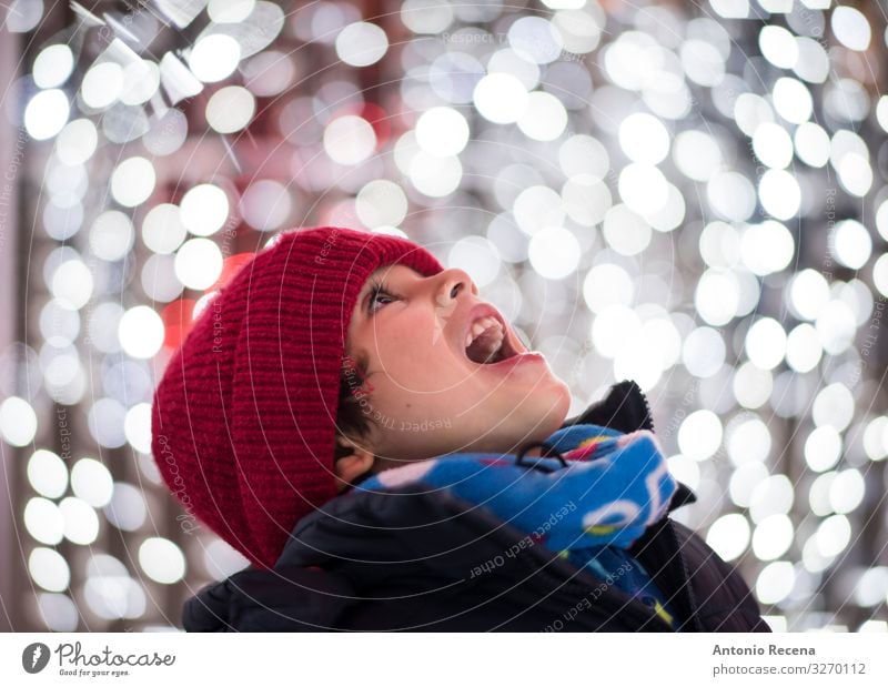 boy head shot portrait looking christmas lights Joy Winter Feasts & Celebrations Child Human being Boy (child) Scarf Hat Smiling White Emotions Enthusiasm