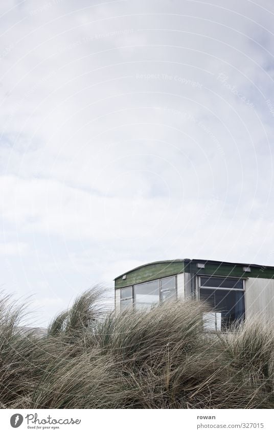 caravan Bad weather Wind Coast Beach Old Mobile home Dune Beach dune Vantage point Glass Window Vacation & Travel Loneliness Uninhabited Gloomy Temporary