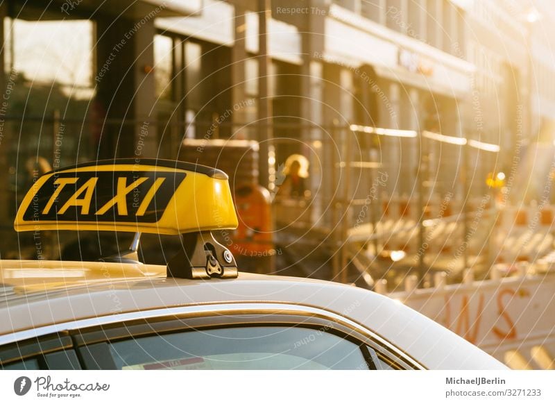 Taxi sign on the roof of a car, city motif with construction site Life Means of transport Public transit Motoring Yellow Berlin Germany City Signs and labeling