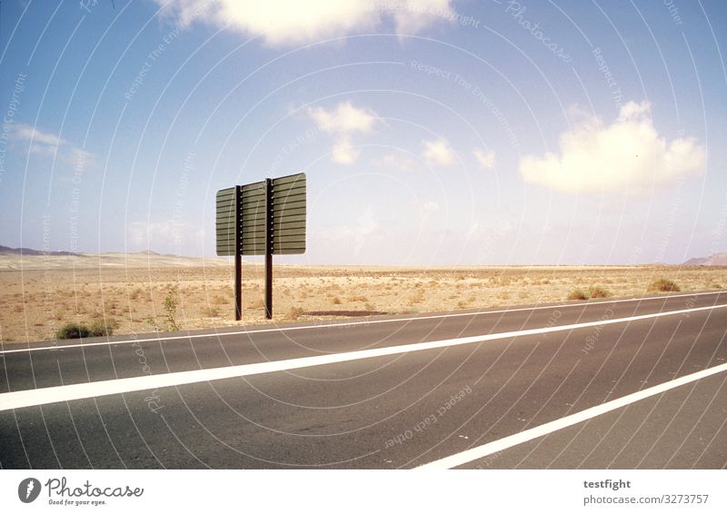 barren land Environment Nature Landscape Earth Sand Sky Beautiful weather Street Longing Loneliness Road sign Road marking Clouds Exterior shot Copy Space top