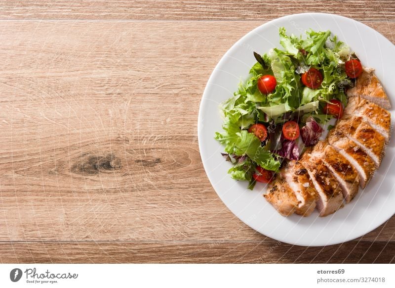 Grilled chicken breast with vegetables on wooden table. Food Healthy Eating Food photograph Meat Meal Salad Dinner Plate Chicken BBQ White Tomato Pork Frying