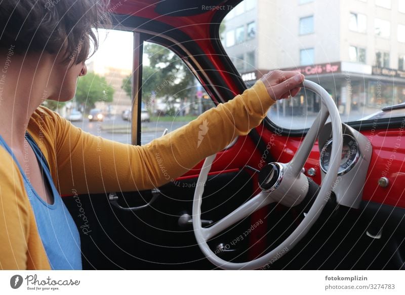 Woman at the wheel of a classic car Driving Vintage car Steering nostalgically Dashboard Adults Car Small car Steering wheel Fiat Fittings fittings Motoring