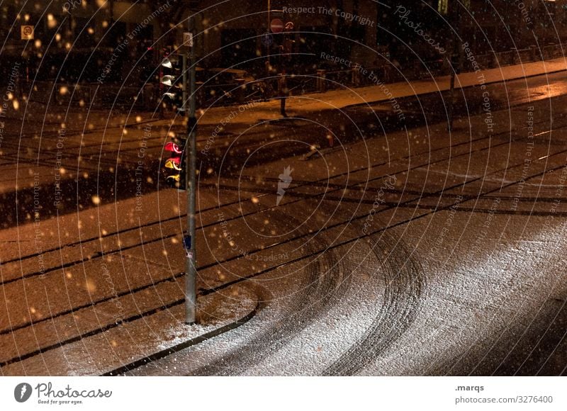 winter night Winter Snow Snowfall Transport Traffic infrastructure Street Traffic light Skid marks Dark Moody Loneliness Lanes & trails Colour photo