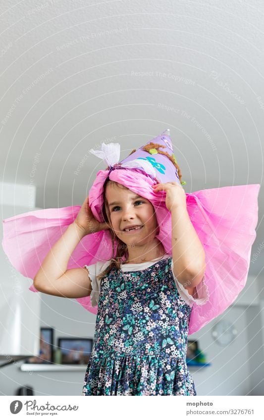 Girl with school bag on her head First day at school First Grader celebration girl start of school School beginners Schoolchild School candy cone tute