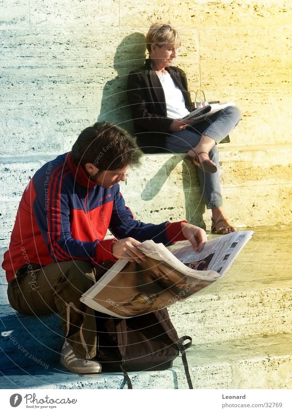 reading newspaper Man Woman Print media Reader Reading Magazine Seating Pond Break Calm Newspaper Human being Sun Ladder Stairs Sit Chair step shade