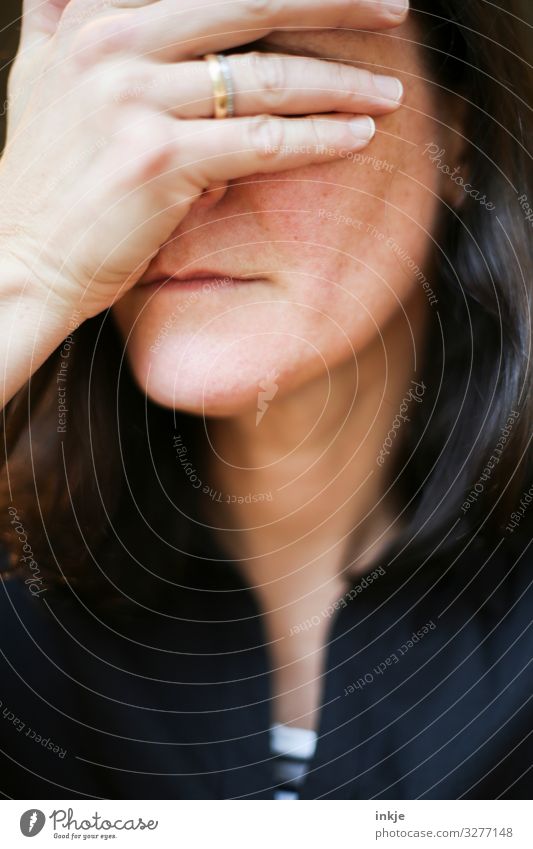 Female face with hand in front of the eyes Close-up Woman portrait Face Colour photo hand in front of one's eyes see pale Long-haired in one's forties