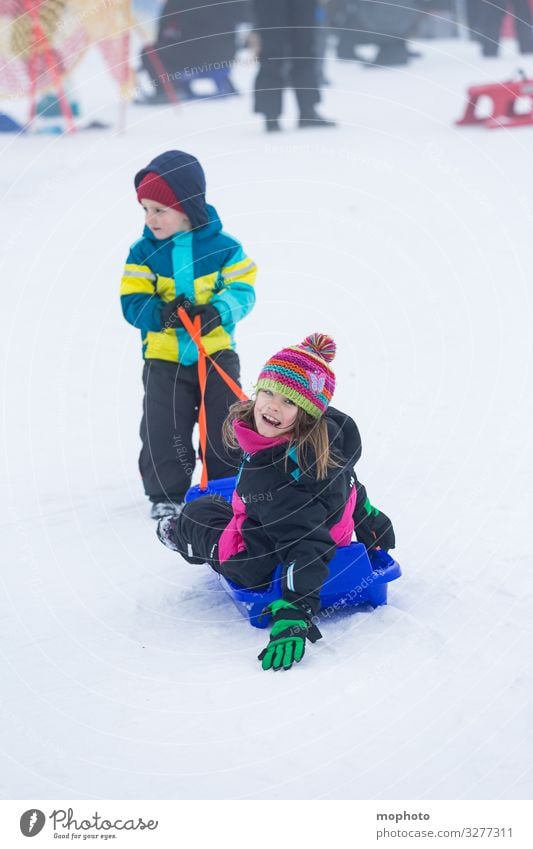 Boy pulls big sister in sleigh, Feldberg, Black Forest girl Trip Brother Driving holidays Joy Friends Friendship Happiness Brothers and sisters luck fortunate