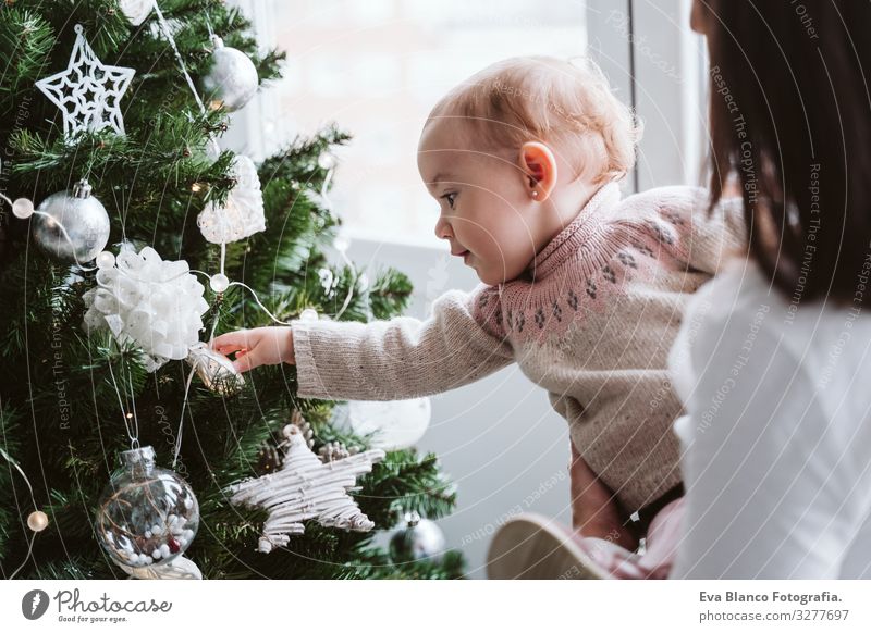 happy mother and baby girl decorating the Christmas tree Mother motherhood Happy Cute Baby Girl one year Christmas & Advent Tree Joy Family & Relations Love