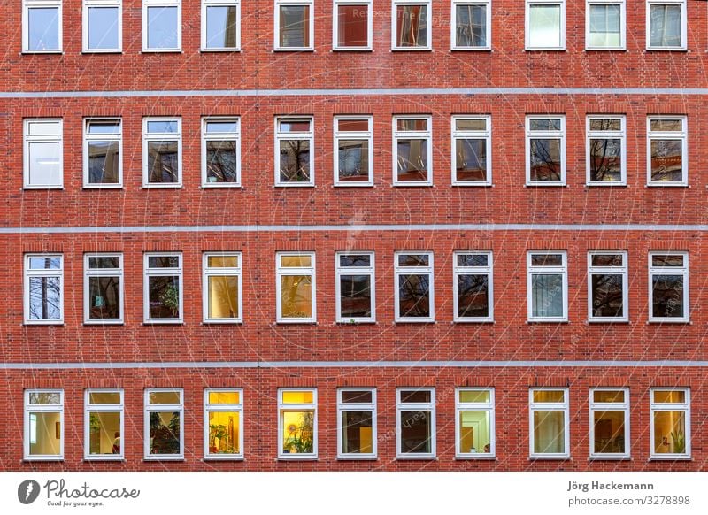 facade of office building by night Life House (Residential Structure) Work and employment Office Business Town Building Architecture Facade Brick Old Modern